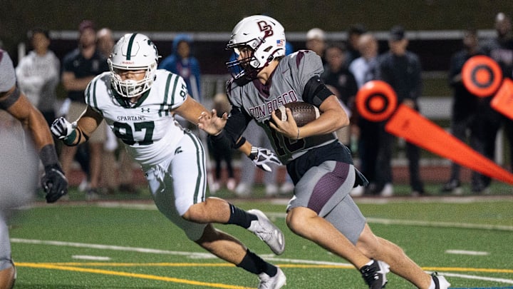 Oct 4, 2024; Ramsey, New Jersey, United States; DePaul football at Don Bosco. DB #16 QB Dylan Wrona on his way to scoring a touchdown in the first quarter. Oct 4, 2024; Ramsey, New Jersey, United States; DePaul football at Don Bosco. DB #16 QB Dylan Wrona on his way to scoring a touchdown in the first quarter.