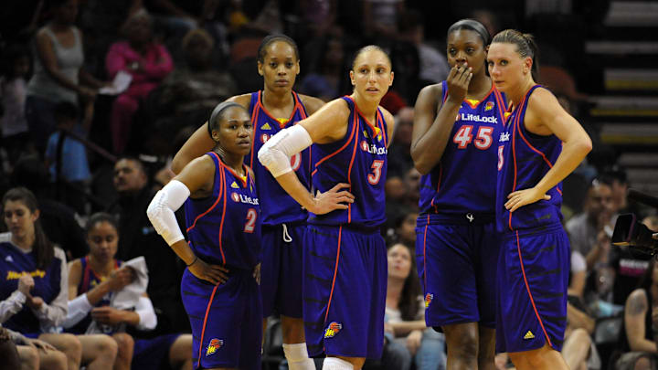 August 28, 2010; San Antonio, TX, USA; Phoenix Mercury players (from left) Temeka Johnson and Tangela Smith and Diana Taurasi and Kara Braxton and Penny Taylor wait for the start of the second quarter against the San Antonio Silver Stars during the first half at the AT&T Center. Phoenix beat San Antonio 92-73. Mandatory Credit: Brendan Maloney-Imagn Images