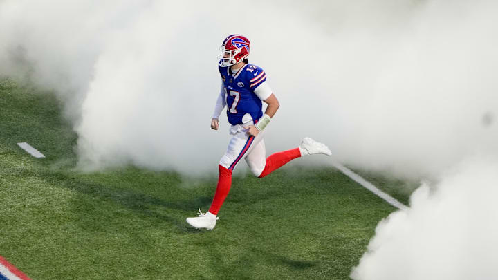 Jan 4, 2026; Orchard Park, New York, USA; Buffalo Bills quarterback Josh Allen (17) runs onto the field before the game against the New York Jets at Highmark Stadium.