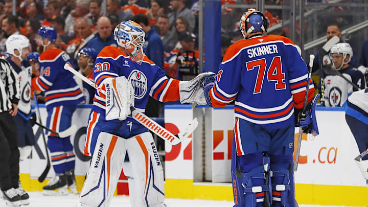 Oct 9, 2024; Edmonton, Alberta, CAN; Edmonton Oilers goaltender Calvin Pickard (30) replaces goaltender Stuart Skinner (74) after allowing 5 goal on 13 shots against the Winnipeg Jets at Rogers Place. Mandatory Credit: Perry Nelson-Imagn Images