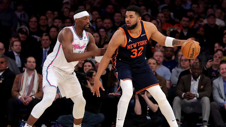 Mar 17, 2025; New York, New York, USA; New York Knicks center Karl-Anthony Towns (32) controls the ball against Miami Heat center Bam Adebayo (13) during the fourth quarter at Madison Square Garden. Mandatory Credit: Brad Penner-Imagn Images