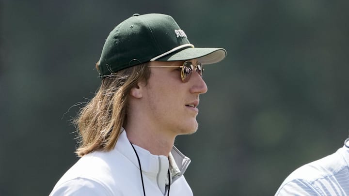 Apr 12, 2025; Augusta, Georgia, USA; Jacksonville Jaguars quarterback Trevor Lawrence walks past no. 10 during the third round of the Masters Tournament at Augusta National Golf Club. Mandatory Credit: Kyle Terada-Imagn Images