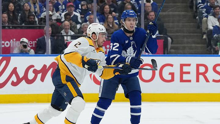 Oct 6, 2026; Toronto, Ontario, CAN;  Toronto Maple Leafs left wing Gavin McKenna (92) battles with Nashville Predators defenseman Adam Wilsby (2) during the first period at Scotiabank Arena.  Mandatory Credit: Nick Turchiaro-Imagn Images