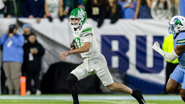 Dec 5, 2025; New Orleans, LA, USA;  North Texas Mean Green quarterback Drew Mestemaker (17) scrambles out the pocket against the Tulane Green Wave during the first half in the 2025 American Championship at Yulman Stadium. Mandatory Credit: Stephen Lew-Imagn Images