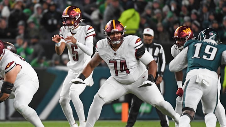 Nov 14, 2024; Philadelphia, Pennsylvania, USA; Washington Commanders offensive tackle Brandon Coleman (74) blocks for quarterback Jayden Daniels (5) against the Philadelphia Eagles at Lincoln Financial Field. Mandatory Credit: Eric Hartline-Imagn Images