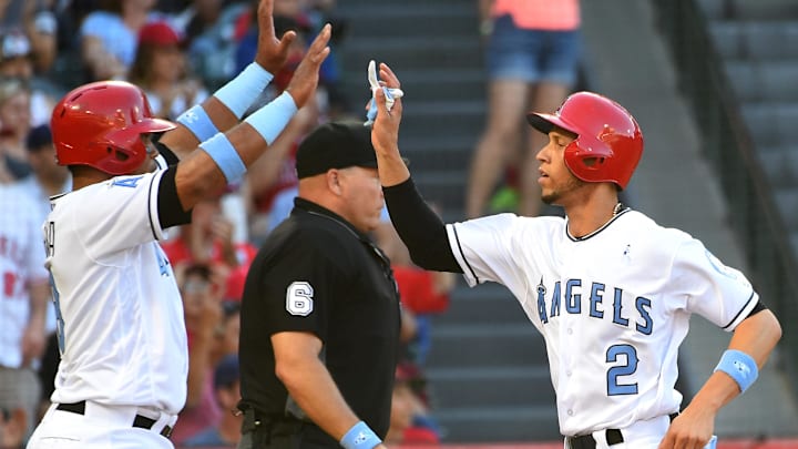 Angels catcher Martin Maldonado (12) and shortstop Andrelton Simmons (2) both scored on a single by second baseman Danny Espinosa (3) singles in two runs in the fifth inning against the Kansas City Royals at Angel Stadium of Anaheim. Angels catcher Martin Maldonado (12) and shortstop Andrelton Simmons (2) both scored on a single by second baseman Danny Espinosa (3) singles in two runs in the fifth inning against the Kansas City Royals at Angel Stadium of Anaheim.