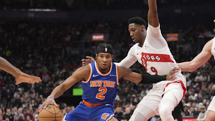 Dec 9, 2024; Toronto, Ontario, CAN; New York Knicks guard Miles McBride (2) dribbles against Toronto Raptors guard RJ Barrett (9) during the first half at Scotiabank Arena. Mandatory Credit: John E. Sokolowski-Imagn Images Dec 9, 2024; Toronto, Ontario, CAN; New York Knicks guard Miles McBride (2) dribbles against Toronto Raptors guard RJ Barrett (9) during the first half at Scotiabank Arena. Mandatory Credit: John E. Sokolowski-Imagn Images