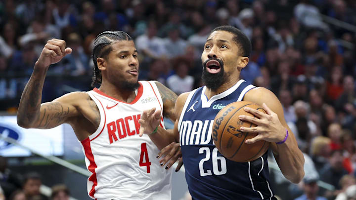 Oct 31, 2024; Dallas, Texas, USA;  Dallas Mavericks guard Spencer Dinwiddie (26) drives to the basket as Houston Rockets guard Jalen Green (4) defends during the second half at American Airlines Center. Mandatory Credit: Kevin Jairaj-Imagn Images