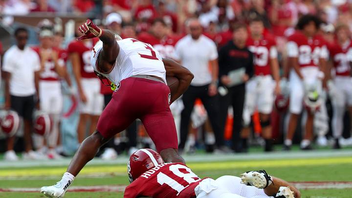Sep 19, 2026; Tuscaloosa, Alabama, USA; Florida State Seminoles running back Samuel Singleton Jr. (3) is tripped up by Alabama Crimson Tide defensive back Bray Hubbard (18) during the first quarter at Saban Field at Bryant-Denny Stadium. Mandatory Credit: David Leong-Imagn Images