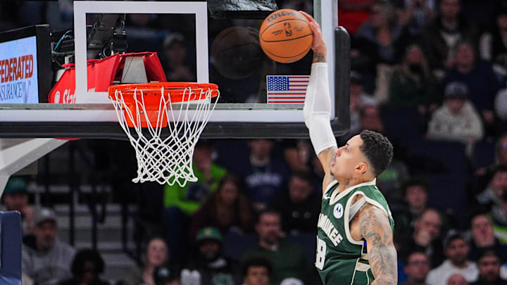 Feb 12, 2025; Minneapolis, Minnesota, USA: Milwaukee Bucks forward Kyle Kuzma (18) dunks against the Minnesota Timberwolves in the second quarter at Target Center. Mandatory Credit: Brad Rempel-Imagn Images