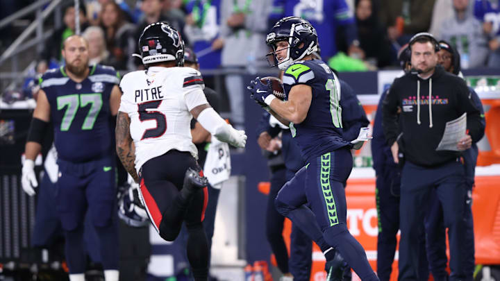 Oct 20, 2025; Seattle, Washington, USA; Seattle Seahawks wide receiver Cooper Kupp (10) runs after a catch against Houston Texans safety Jalen Pitre (5) during the first quarter at Lumen Field. Mandatory Credit: Kevin Ng-Imagn Images