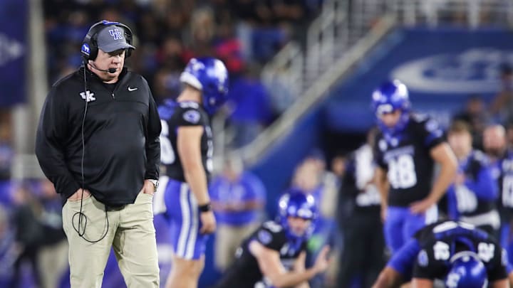 Kentucky head coach Mark Stoops walks the field during a time out as his special teams practice snapping the ball for extra point attempts at Kroger Field Saturday, Oct. 12, 2024 in Lexington, Ky.