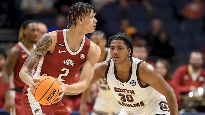 Mar 14, 2024; Nashville, TN, USA; South Carolina Gamecocks forward Collin Murray-Boyles (30) guards Arkansas Razorbacks forward Trevon Brazile (2) during the second half at Bridgestone Arena. Mandatory Credit: Steve Roberts-Imagn Images