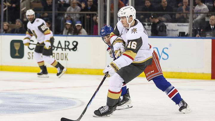 Dec 7, 2025; New York, New York, USA;  New York Rangers center Noah Laba (42) and Vegas Golden Knights right wing Pavel Dorofeyev (16) battle for control of the puck in the first period at Madison Square Garden. Mandatory Credit: Wendell Cruz-Imagn Images