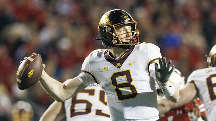 Nov 26, 2022; Madison, Wisconsin, USA;  Minnesota Golden Gophers quarterback Athan Kaliakmanis (8) throws a pass during the third quarter against the Wisconsin Badgers at Camp Randall Stadium. Mandatory Credit: Jeff Hanisch-Imagn Images