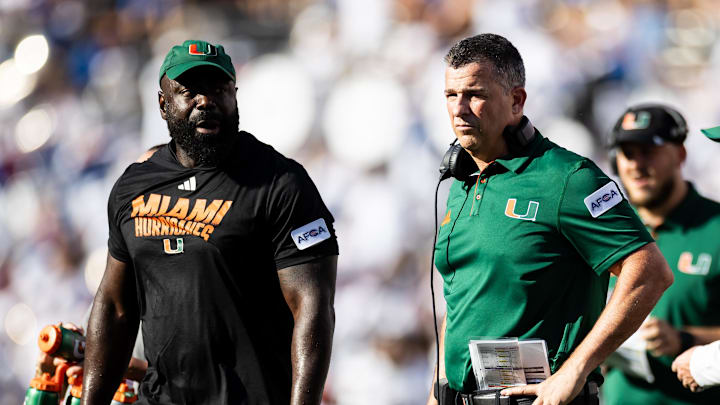 Aug 31, 2024; Gainesville, Florida, USA; Miami Hurricanes head coach Mario Cristobal looks during the second half against the Florida Gators at Ben Hill Griffin Stadium. Mandatory Credit: Matt Pendleton-Imagn Images Aug 31, 2024; Gainesville, Florida, USA; Miami Hurricanes head coach Mario Cristobal looks during the second half against the Florida Gators at Ben Hill Griffin Stadium. Mandatory Credit: Matt Pendleton-Imagn Images