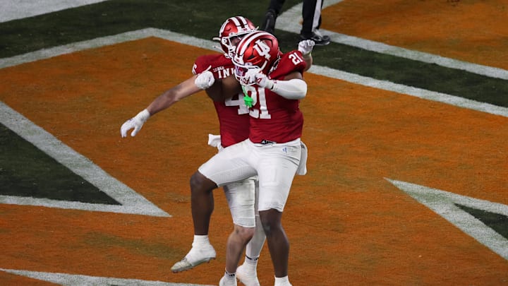 Jan 19, 2026; Miami Gardens, FL, USA; Indiana Hoosiers linebacker Isaiah Jones (46) and linebacker Rolijah Hardy (21) celebrate after a touchdown following a blocked punt against the Miami Hurricanes in the third quarter during the College Football Playoff National Championship game at Hard Rock Stadium. Mandatory Credit: Kim Klement Neitzel-Imagn Images