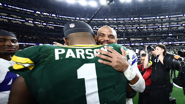 Sep 28, 2025; Arlington, TX; Green Bay Packers defensive end Micah Parsons and Dallas Cowboys quarterback Dak Prescott  embrace after their Week 4 showdown