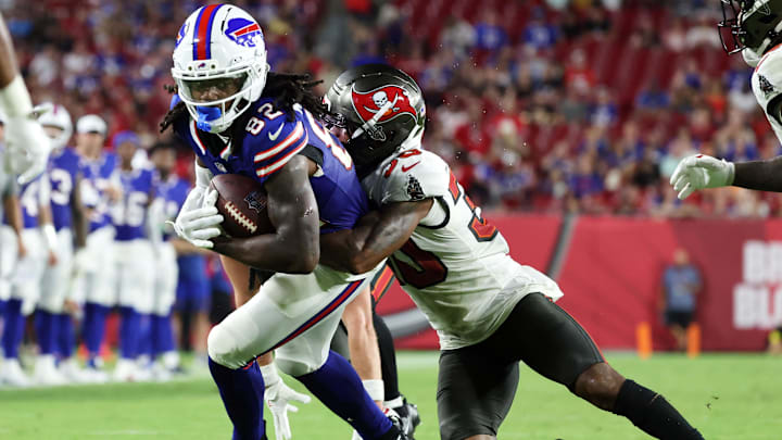 Buffalo Bills wide receiver Kristian Wilkerson (82) runs with the ball as Tampa Bay Buccaneers wide receiver Jacob Harris (30) defends during the second half at Raymond James Stadium. 