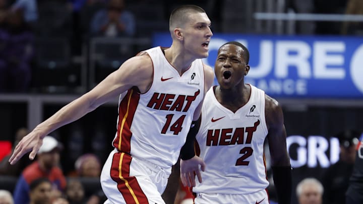 Nov 12, 2024; Detroit, Michigan, USA;  Miami Heat guard Tyler Herro (14) celebrates with guard Terry Rozier (2) in the second half against the Detroit Pistons at Little Caesars Arena. Mandatory Credit: Rick Osentoski-Imagn Images