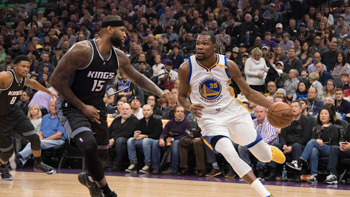 January 8, 2017; Sacramento, CA, USA; Golden State Warriors forward Kevin Durant (35) dribbles the basketball against Sacramento Kings forward DeMarcus Cousins (15) during the first quarter at Golden 1 Center. The Warriors defeated the Kings 117-106. Mandatory Credit: Kyle Terada-Imagn Images