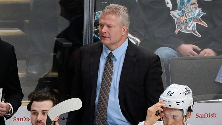 Nov 29, 2024; San Jose, California, USA; Seattle Kraken assistant coach Bob Woods watches the play from the bench against the San Jose Sharks with defenseman Joshua Mahura (28) and defenseman Brandon Montour (62) during the third period at SAP Center at San Jose. Mandatory Credit: Robert Edwards-Imagn Images Nov 29, 2024; San Jose, California, USA; Seattle Kraken assistant coach Bob Woods watches the play from the bench against the San Jose Sharks with defenseman Joshua Mahura (28) and defenseman Brandon Montour (62) during the third period at SAP Center at San Jose. Mandatory Credit: Robert Edwards-Imagn Images