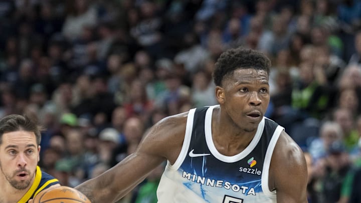Mar 17, 2025; Minneapolis, Minnesota, USA; Minnesota Timberwolves guard Anthony Edwards (5) dribbles the ball against the Indiana Pacers in the first half at Target Center. Mandatory Credit: Jesse Johnson-Imagn Images