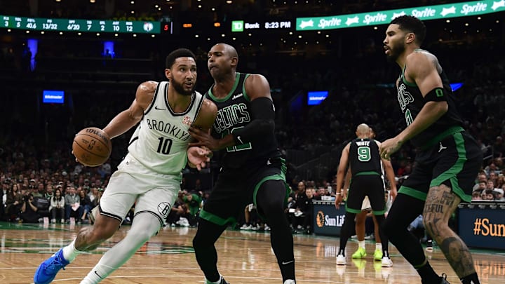 Nov 8, 2024; Boston, Massachusetts, USA;  Brooklyn Nets guard Ben Simmons (10) controls the ball while Boston Celtics center Al Horford (42) defends during the first half at TD Garden. Mandatory Credit: Bob DeChiara-Imagn Images