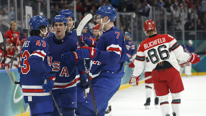 Feb 14, 2026; Milan, Italy;   Jack Hughes of United States celebrates scoring their sixth goal with teammates against Denmark in men's ice hockey group C play during the Milano Cortina 2026 Olympic Winter Games at Milano Santagiulia Ice Hockey Arena. Mandatory Credit: Geoff Burke-Imagn Images
