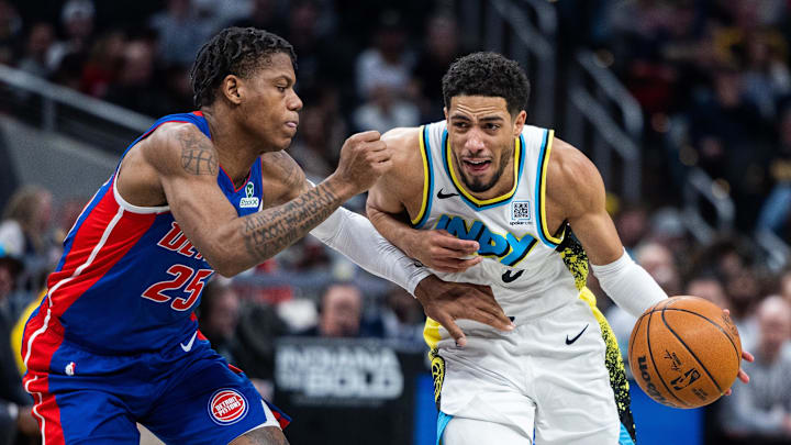 Jan 29, 2025; Indianapolis, Indiana, USA; Indiana Pacers guard Tyrese Haliburton (0) dribbles the ball while Detroit Pistons guard Marcus Sasser (25) defends in the first half at Gainbridge Fieldhouse. Mandatory Credit: Trevor Ruszkowski-Imagn Images