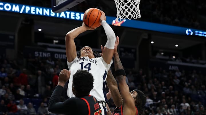 Penn State Nittany Lions forward Yanic Konan Niederhauser (14) drives the ball to the basket against Maryland during the first half at Bryce Jordan Center.