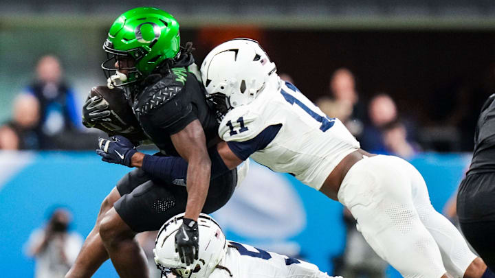 Oregon Ducks running back Noah Whittington (6) carries the ball Saturday, Dec. 7, 2024, during the Big Ten Championship game between the Oregon Ducks and the Penn State Nittany Lions at Lucas Oil Stadium in Indianapolis. The Ducks defeated the Nittany Lions, 45-37.