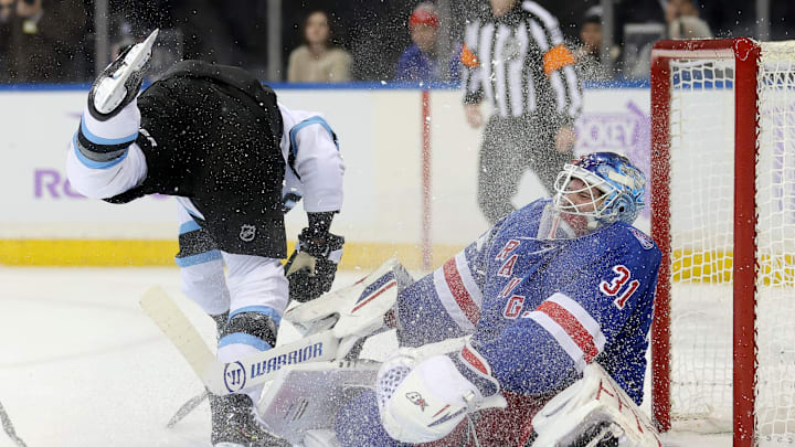 Jan 5, 2026; New York, New York, USA; New York Rangers goaltender Igor Shesterkin (31) reacts after being skated into by Utah Mammoth right wing JJ Peterka (77) during the first period at Madison Square Garden. Shesterkin left the game with an injury after the play. Mandatory Credit: Brad Penner-Imagn Images