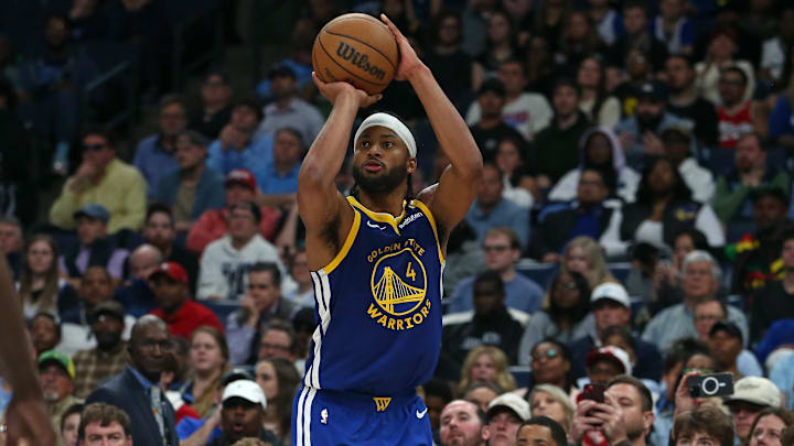 Apr 1, 2025; Memphis, Tennessee, USA; Golden State Warriors guard Moses Moody (4) shoots for three during the fourth quarter against the Memphis Grizzlies at FedExForum. Mandatory Credit: Petre Thomas-Imagn Images
