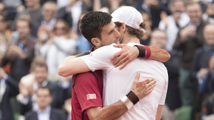 Novak Djokovic and Andy Murray embrace at the net after their match on day 15 of the 2016 French Open. 