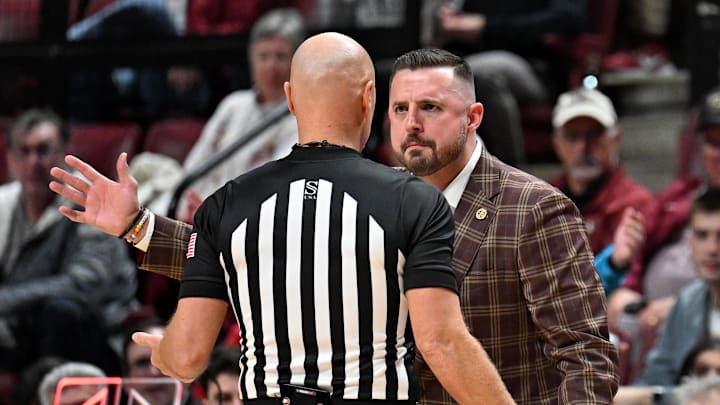 Feb 24, 2026; Tallahassee, Florida, USA; Florida State Seminoles head coach Luke Loucks exchanges words with a referee during the first half against the Miami Hurricanes at Donald L. Tucker Center. Mandatory Credit: Melina Myers-Imagn Images