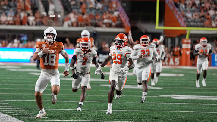 Sep 20, 2025; Austin, Texas, USA; Texas Longhorns quarterback Matthew Caldwell (18) runs for a long gain after keeping the ball during the second half against the Sam Houston Bearkats at Darrell K Royal-Texas Memorial Stadium. Mandatory Credit: Scott Wachter-Imagn Images