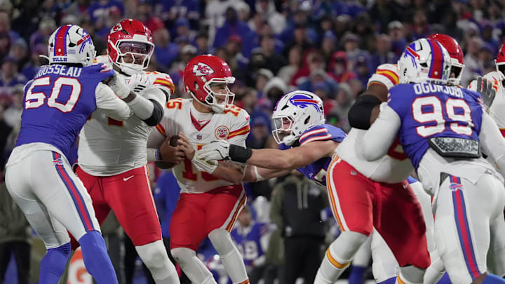 Buffalo Bills defensive end Joey Bosa gets a hold of Kansas City Chiefs quarterback Patrick Mahomes and forces him to give up throwing a pass during second half action against the Kansas City Chiefs.
