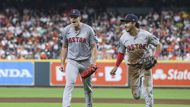 Boston Red Sox starting pitcher Nick Pivetta (37) and second baseman David Hamilton (70) react after a play during the fourth inning against the Houston Astros at Minute Maid Park in 2024.