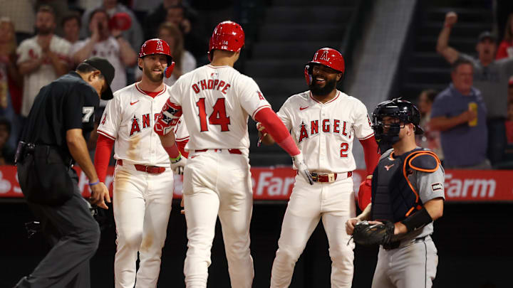 Jun 28, 2024; Anaheim, California, USA;  Los Angeles Angels catcher Logan O'Hoppe (14) is greeted by designated hitter Taylor Ward (3) and third baseman Luis Rengifo (2) after hitting a three-run home run during the eighth inning against the Detroit Tigers at Angel Stadium. Mandatory Credit: Kiyoshi Mio-Imagn Images