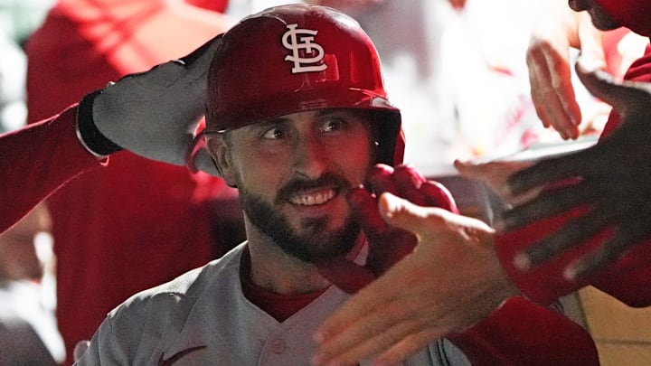 May 9, 2023; Chicago, Illinois, USA; St. Louis Cardinals shortstop Paul DeJong (11) is greeted in the dugout after hitting a home run against the Chicago Cubs during the ninth inning at Wrigley Field. Mandatory Credit: David Banks-Imagn Images