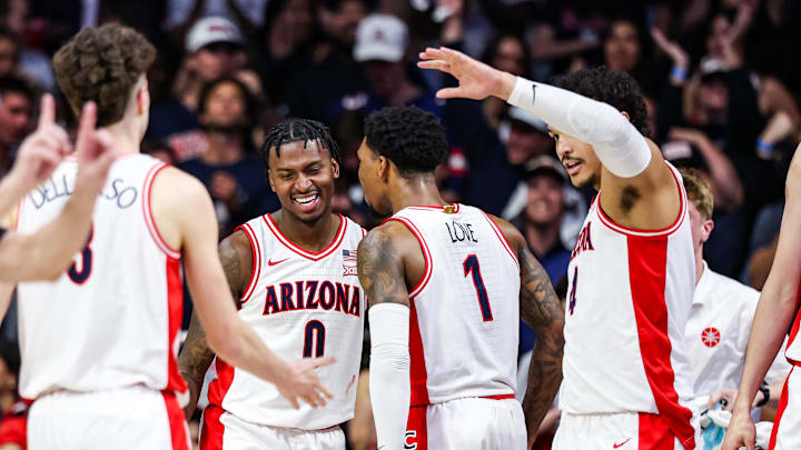 Feb 26, 2025; Tucson, Arizona, USA; Arizona Wildcats guard Jaden Bradley (0) celebrates with Arizona Wildcats guard Caleb Love (1) during the first half against the Utah Utes at McKale Center. Mandatory Credit: Aryanna Frank-Imagn Images
