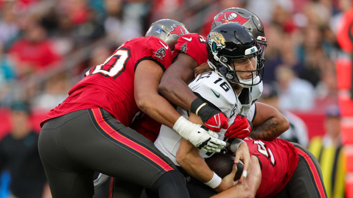 Dec 24, 2023; Tampa, Florida, USA; Jacksonville Jaguars quarterback Trevor Lawrence (16) is sacked by Tampa Bay Buccaneers linebacker Lavonte David (54) in the second quarter at Raymond James Stadium. Mandatory Credit: Nathan Ray Seebeck-USA TODAY Sports Dec 24, 2023; Tampa, Florida, USA; Jacksonville Jaguars quarterback Trevor Lawrence (16) is sacked by Tampa Bay Buccaneers linebacker Lavonte David (54) in the second quarter at Raymond James Stadium. Mandatory Credit: Nathan Ray Seebeck-USA TODAY Sports