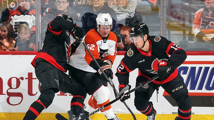 Noel Acciari, Andre Burakovsky and Shane Pinto battling for a puck during the Ottawa Senators and Philadelphia Flyers game Saturday night. The Flyers won 3-1 and secured their first win of the season.