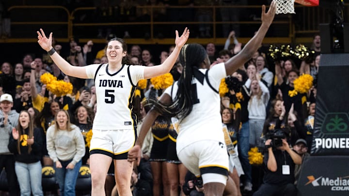Iowa center Ava Heiden (5) and Iowa guard Chit-Chat Wright (11) react during a game against the Michigan Wolverines Feb. 22, 2026 at Carver-Hawkeye Arena in Iowa City, Iowa. Iowa center Ava Heiden (5) and Iowa guard Chit-Chat Wright (11) react during a game against the Michigan Wolverines Feb. 22, 2026 at Carver-Hawkeye Arena in Iowa City, Iowa.