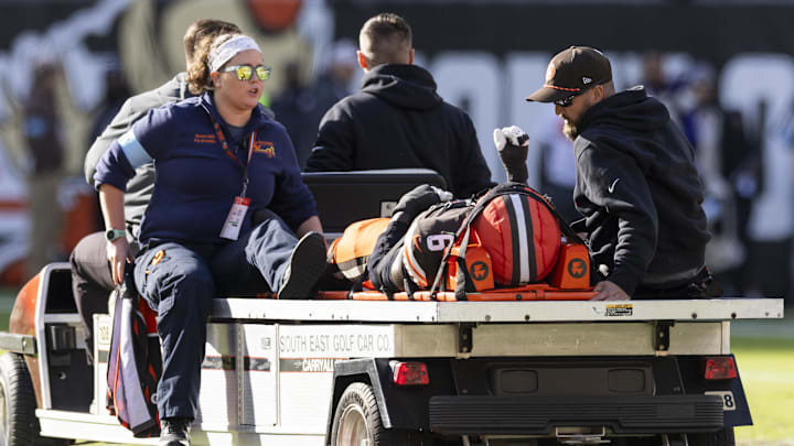 Oct 27, 2024; Cleveland, Ohio, USA; Cleveland Browns linebacker Jeremiah Owusu-Koramoah (6) lays on the medical cart after an injury during the third quarter against the Baltimore Ravens at Huntington Bank Field. Mandatory Credit: Scott Galvin-Imagn Images