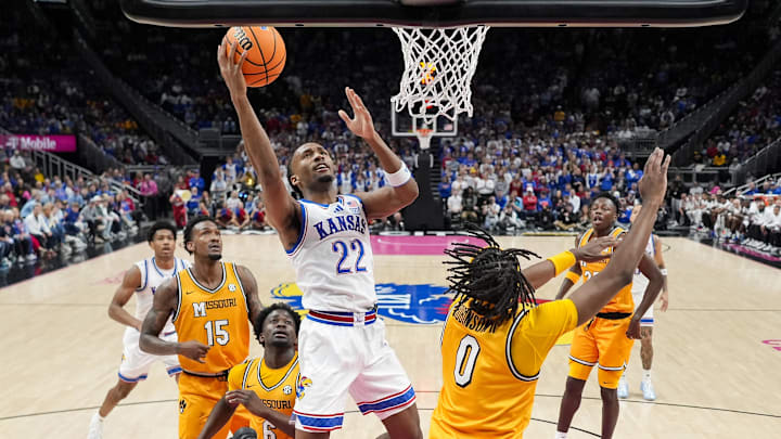 Dec 7, 2025; Kansas City, Missouri, USA; Kansas Jayhawks guard Darryn Peterson (22) shoots during the first half against the Missouri Tigers at T-Mobile Center. Mandatory Credit: Jay Biggerstaff-Imagn Images