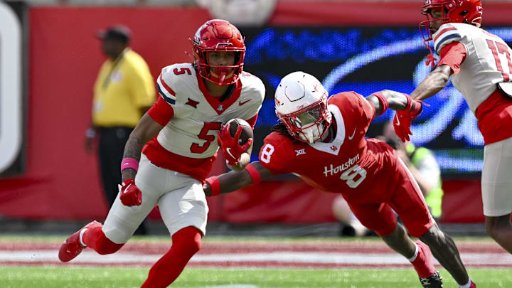 Oct 18, 2025; Houston, Texas, USA; Houston Cougars defensive back Kentrell Webb (8) attempts to tackle Arizona Wildcats wide receiver Gio Richardson (5) during the first half at TDECU Stadium. Mandatory Credit: Maria Lysaker-Imagn Images Oct 18, 2025; Houston, Texas, USA; Houston Cougars defensive back Kentrell Webb (8) attempts to tackle Arizona Wildcats wide receiver Gio Richardson (5) during the first half at TDECU Stadium. Mandatory Credit: Maria Lysaker-Imagn Images