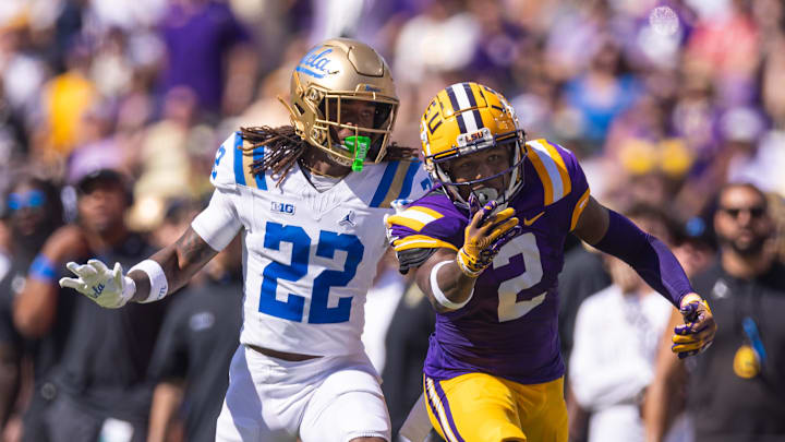 Sep 21, 2024; Baton Rouge, Louisiana, USA; LSU Tigers wide receiver Kyren Lacy (2) misses a pass against UCLA Bruins defensive back Croix Stewart (22) during the first half at Tiger Stadium. Mandatory Credit: Stephen Lew-Imagn Images Sep 21, 2024; Baton Rouge, Louisiana, USA; LSU Tigers wide receiver Kyren Lacy (2) misses a pass against UCLA Bruins defensive back Croix Stewart (22) during the first half at Tiger Stadium. Mandatory Credit: Stephen Lew-Imagn Images