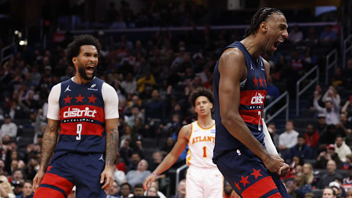Nov 25, 2025; Washington, District of Columbia, USA; Washington Wizards center Alex Sarr (20) reacts after a dunk alongside Wizards forward Justin Champagnie (9) against the Atlanta Hawks in the second half at Capital One Arena. Mandatory Credit: Geoff Burke-Imagn Images